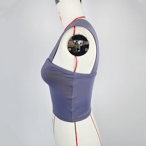 Detail shot of purple crop top with seamless stitching and high-stretch fabric on mannequin