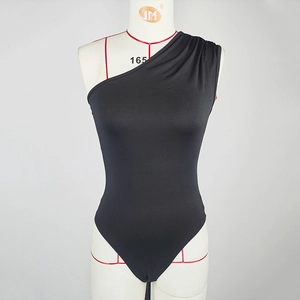 Detail of elegant black one-shoulder bodysuit with ruching on shoulder and elastic fabric
