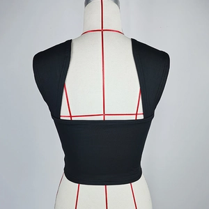 Detail view of the black racerback crop top with high elasticity and neat stitching