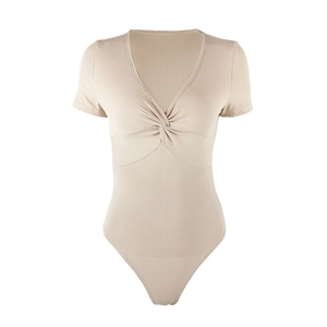 Close-up of the twist-front V-neck detail on this ribbed knit beige bodysuit for women
