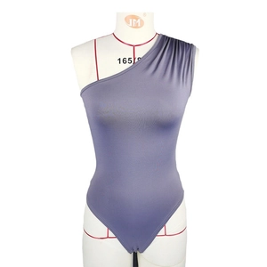 Detail shot of the mauve one-shoulder bodysuit fabric and stylish side pleats texture
