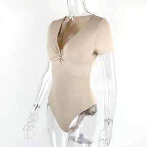 Detailed view of the ribbed fabric and front knot design on a beige bodysuit