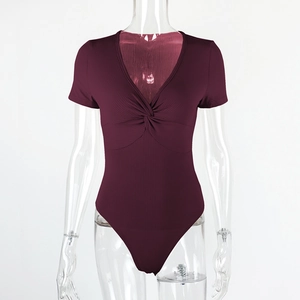 Detailed view of the twisted knot chest design and ribbed texture of the wine red bodysuit