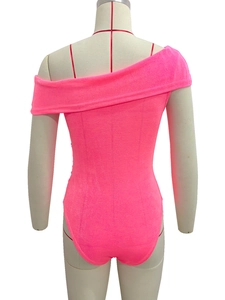 Rear view on mannequin of fluorescent pink off-shoulder bodysuit with textured fabric