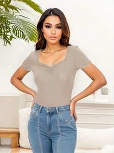 Close-up of khaki ribbed knit texture and sweetheart neckline with ruching detail