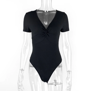 Detail of black ribbed bodysuit featuring a deep V-neck and twist front design