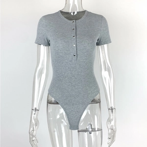 Macro detail of grey ribbed knit bodysuit featuring five metal snap buttons and round neck
