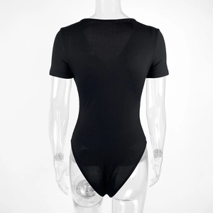 Close-up of black ribbed bodysuit featuring short sleeves and a slim fit design