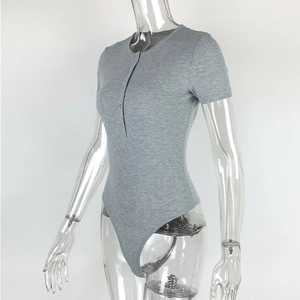 Detail of grey ribbed knit bodysuit featuring front button neck and slim fit short sleeves