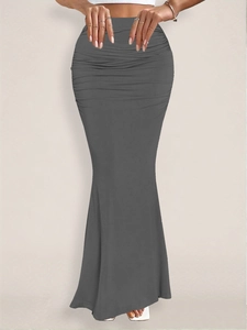 Detail of high waist ruching and elegant mermaid silhouette on charcoal maxi skirt