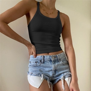 Close-up of black ribbed tank top with U-neck detail on a model with denim shorts