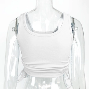 Detailed view of white ribbed crop top featuring side drawstring and ruched texture details