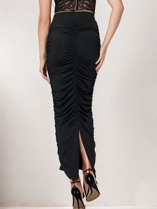 Detail of the back ruched design and bottom slit on this black bodycon maxi skirt
