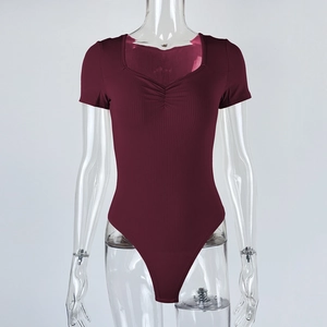 Detail of ribbed wine red bodysuit featuring ruched V-neck and short sleeves
