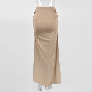 Detailed view of the ruched side texture and high waist seam on this khaki bodycon maxi skirt