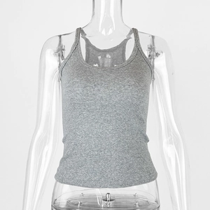 Close-up of the grey ribbed cotton fabric and U-neck detail on the slim-fit tank top