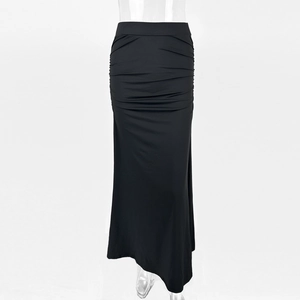 Detail view of the elegant ruched texture on the black slim fit maxi skirt for women