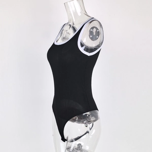 Close-up of ribbed texture and contrast white piping on black sleeveless bodysuit