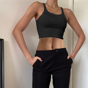 Detail of black ribbed sleeveless crop top with U-neck design on model