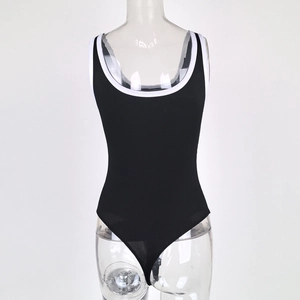 Close-up of black ribbed U-neck bodysuit with white contrast piping on a model