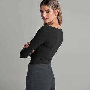 Close-up of black ribbed knit bodysuit showing slim fit design and premium fabric texture
