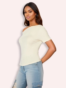 Off-shoulder cream slim fit top with light blue cargo jeans on a model