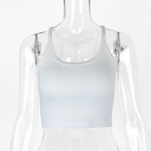 Detail of white ribbed crop top showing U-neckline and fine vertical texture on mannequin