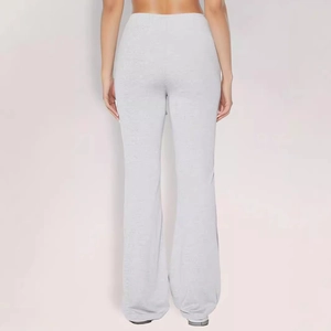Back view of light grey flared trousers with subtle jacquard texture and slimming fit