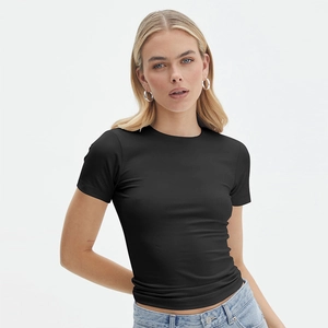 Slim fit black short sleeve T-shirt with crew neck for women paired with denim jeans