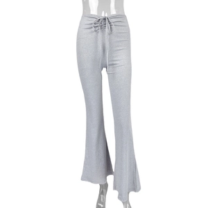 Women's light grey sparkly flared trousers with drawstring waist on white background