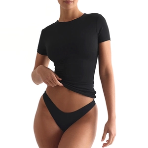 Close-up of slim fit black t-shirt with crew neck and high-stretch ribbed fabric