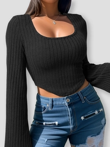 Slim fit square neck ribbed knit top in black paired with distressed blue denim jeans