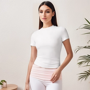 Detailed shot of white slim fit t-shirt with pink tiered waist belt and high waist pants