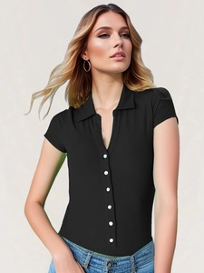 Close-up of black ribbed polo shirt with contrast pearl buttons and knit texture detail