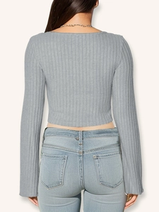 Rear view of grey ribbed long sleeve crop top with v-neck drawstring and slim fit design