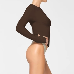 Slim fit dark brown long sleeve crew neck bodysuit top in minimalist solid color style