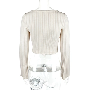 Close-up of the ribbed knit texture and back view of the beige long sleeve crop top