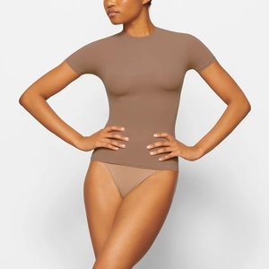 Detail of slim fit crew neck short sleeve tee in coffee brown high elastic fabric