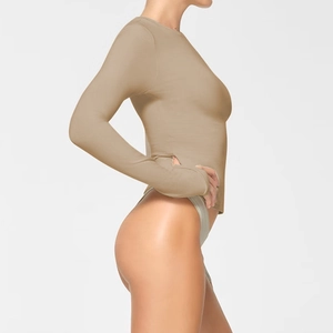 Side view of slim fit long sleeve crew neck top in khaki with elastic knit fabric