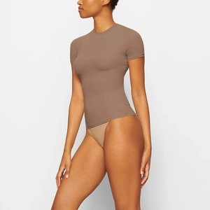 Close-up detail of slim-fit brown crew neck T-shirt in premium high-elasticity fabric