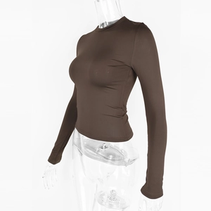 Detail of the brown long sleeve slim fit crew neck top with high elastic ribbed fabric