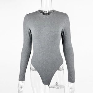 Close-up of dark grey ribbed knit fabric texture on a slim fit long sleeve bodysuit