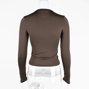 Back view of slim fit long sleeve crew neck top in dark brown glossy stretch fabric