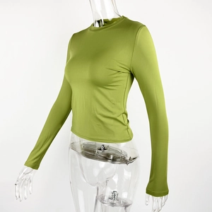 Detail view of avocado green slim fit crop top with high elasticity fabric on mannequin