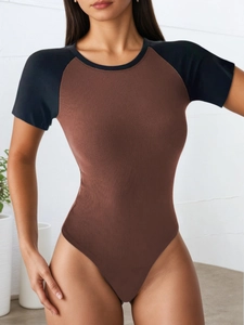 Slim fit ribbed bodysuit with brown body and black contrast raglan short sleeves