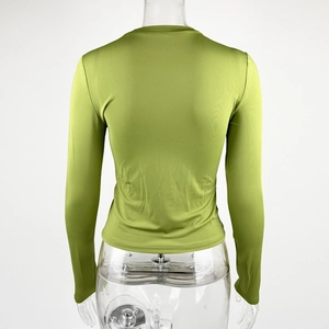 Detail view of the back of a slim fit green long sleeve tee on a clear mannequin