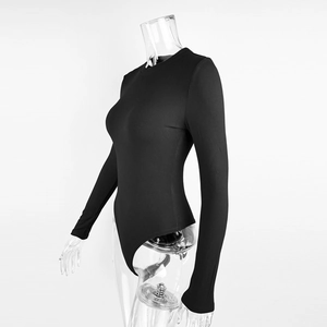 Side view of black ribbed knit bodysuit featuring a round neck and long sleeves on a model