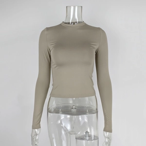 Detail view of khaki slim fit long sleeve top with premium elastic fabric texture