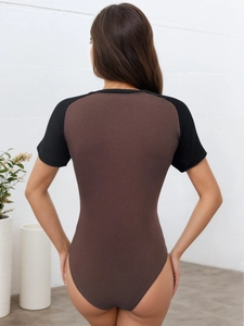 Close-up of the contrast raglan sleeves and ribbed texture on the women's bodysuit