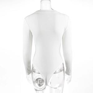 Rear view of white rib-knit bodysuit featuring long sleeves and a high-cut leg opening